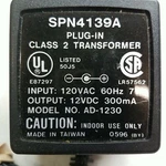 SPN4139A Plug In Class Transformer Charger Model AD-1230 Output 12VDC 300MA. Fixed Price $13.99.