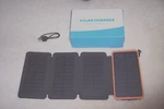 Feelle Solar Power Bank Charger 25000MAH Phone With 4 Panels. Fixed Price $54.15.