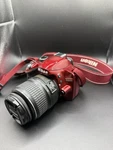 Nikon D3200 Red Camera Bundle Dx 18-55MM Lens, Bag, Charger, Cables, Battery. Fixed Price $300.00.