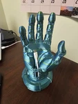 Robot Hand Cell Phone Stand With Charging Cable Access, 3D Printed Desk Holder. Fixed Price $17.49.