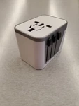 International Power Plug Adapter - Travel White W/4 Usb Ports 3500MA. Fixed Price $16.99.