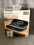Brookstone Wireless Phone Charger With Alarm Clock. Fixed Price $19.99.